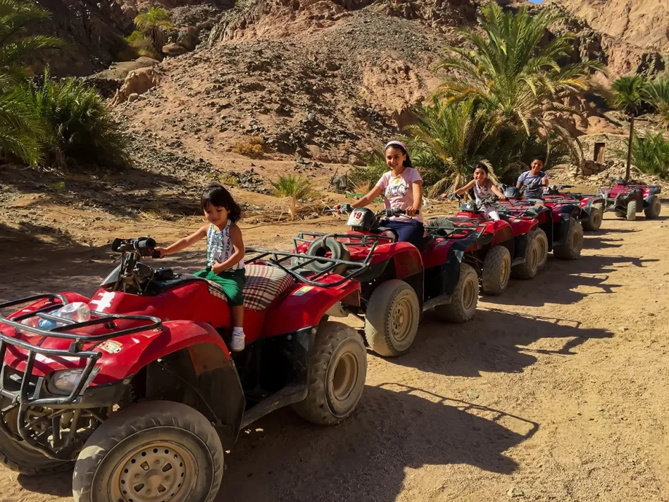Family enjoying quad biking trip from Dahab