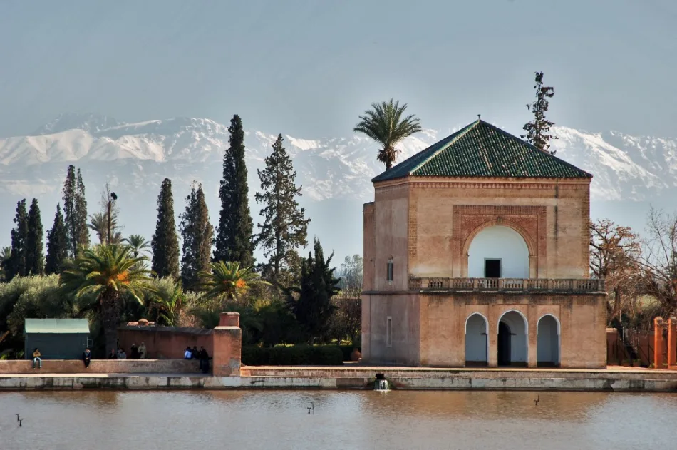 Panoramic view of the Menara Gardens in Marrakech featuring the pavilion, olive groves