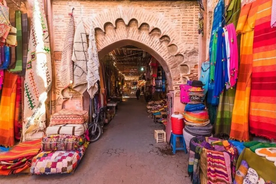 Colorful Marrakech souk with vibrant textiles, lanterns, spices