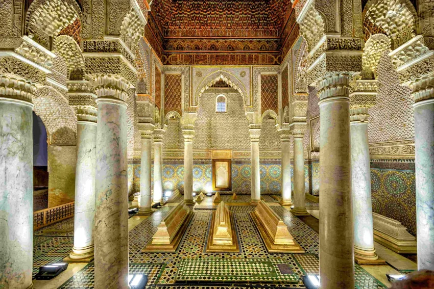 Ornate interior chamber of the Saadian Tombs in Marrakech with detailed carvings